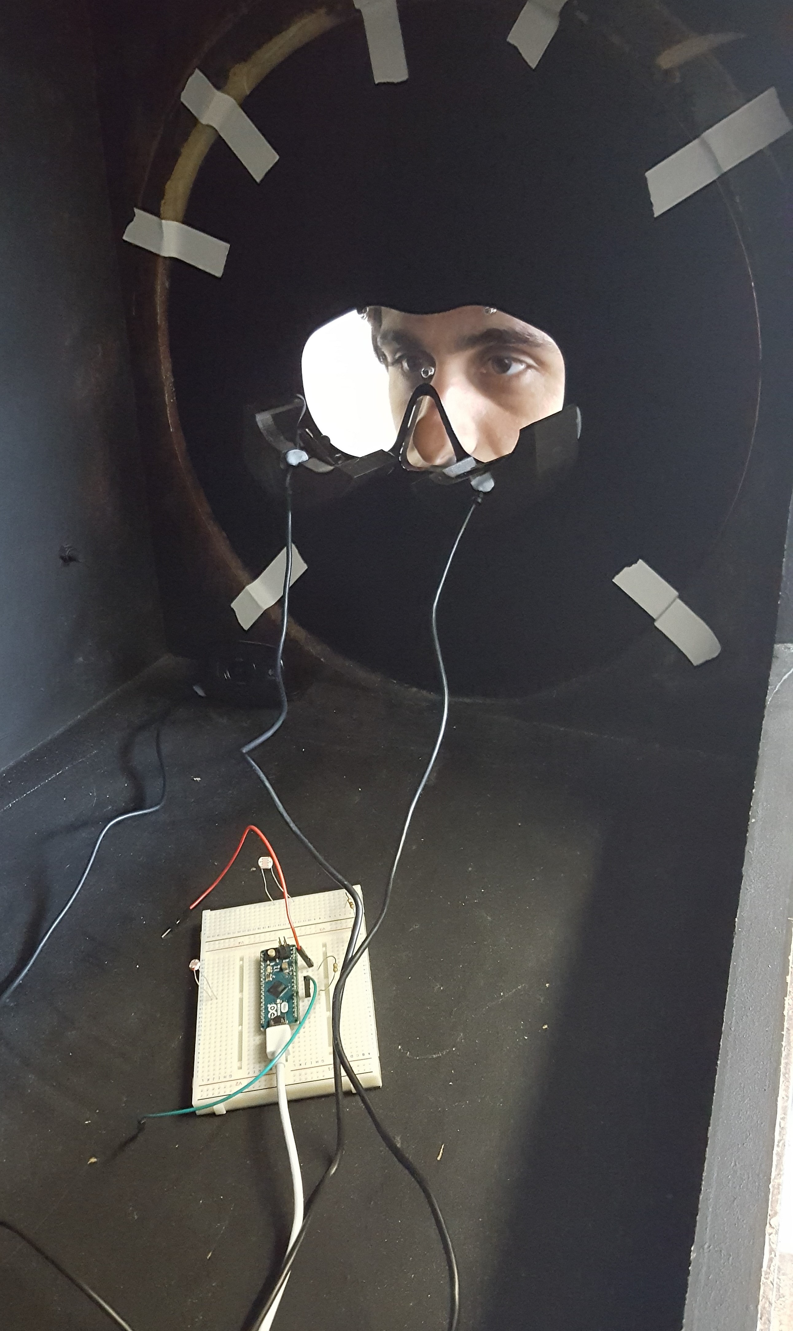 Goncalo peers through the face plate of the interactive station.